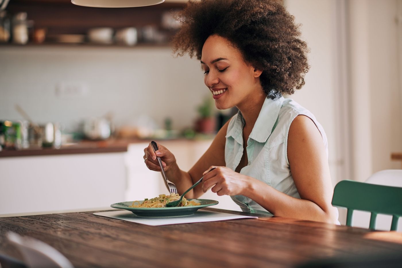 group of people eating pasta